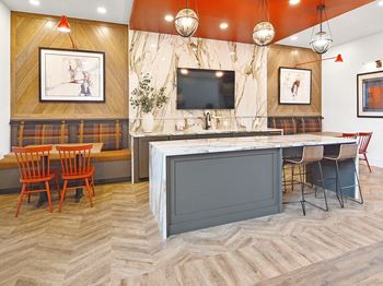 a rendering of a restaurant with a bar and a table and chairs